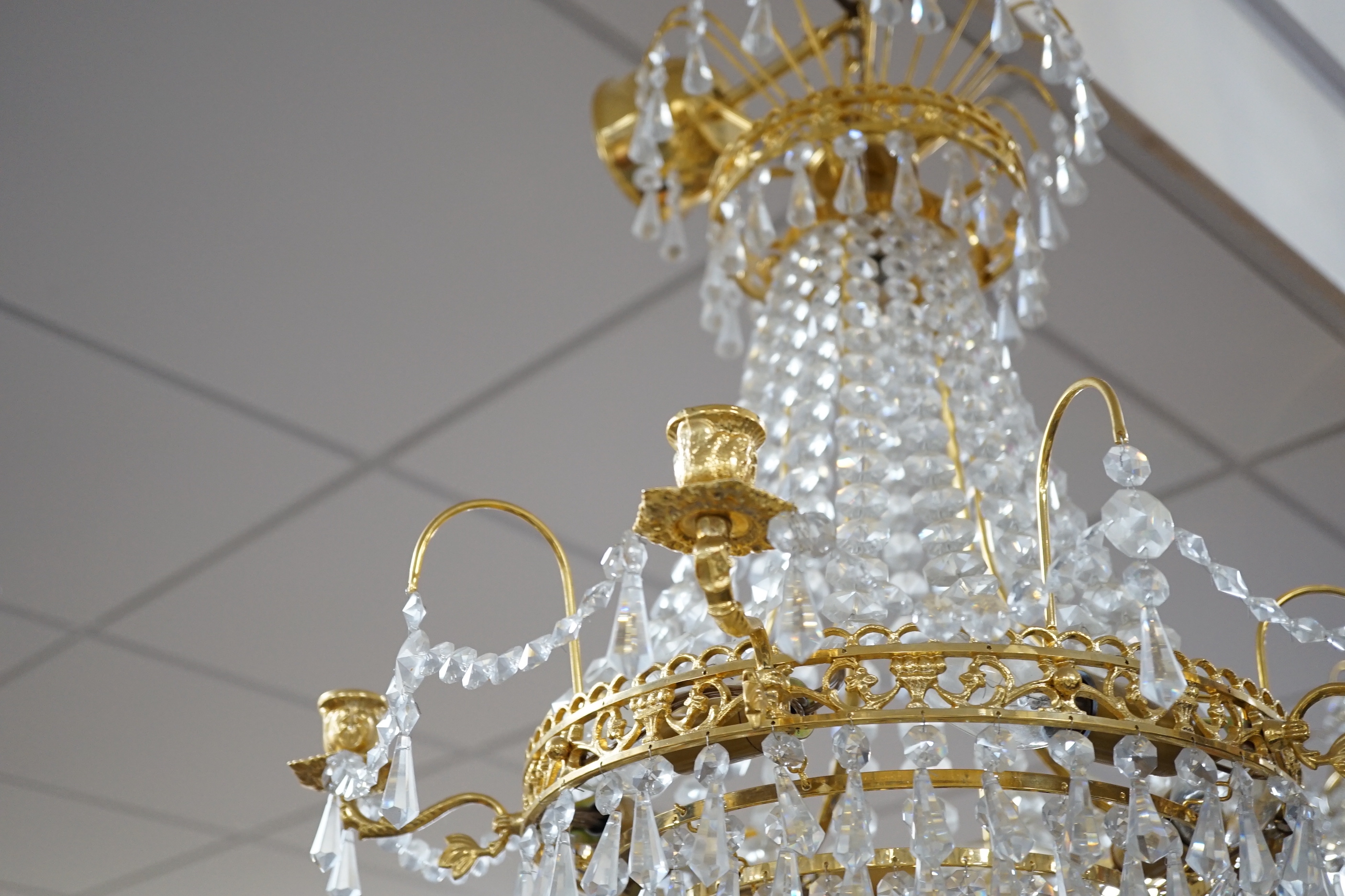 A brass and glass drop three tier chandelier, light approximately 53cm high (not including chain)
